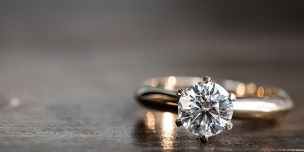 Elegant Diamond Ring Displayed On the Table.