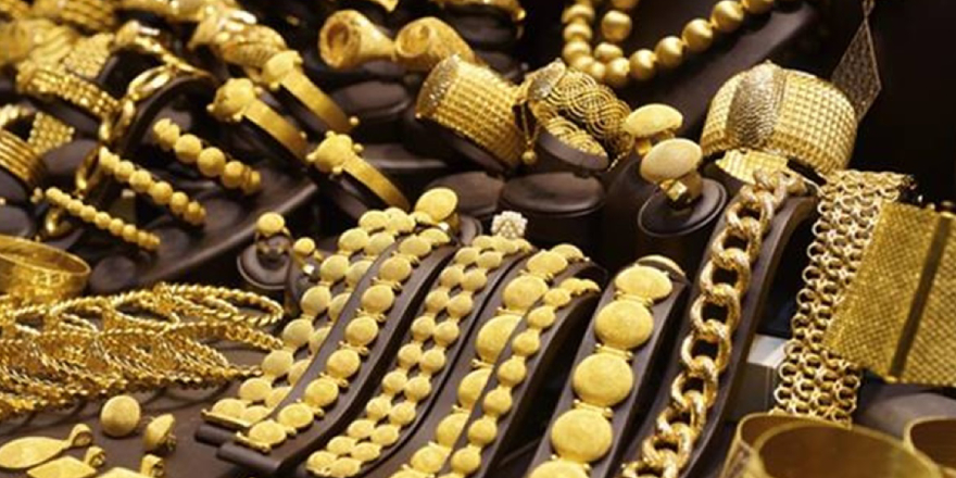 Various Collection Of Gold Ornaments Displayed In Jewelry Shop.