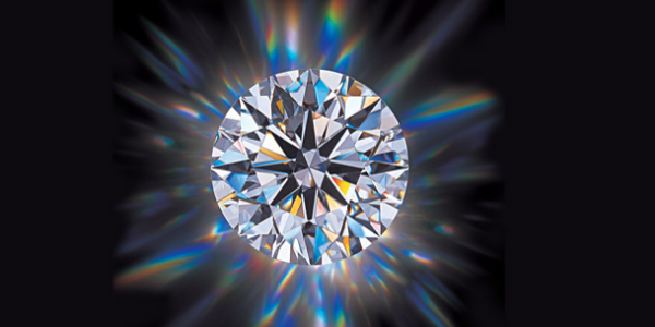Beautiful & Shining Diamond Isolated On A Black Background.