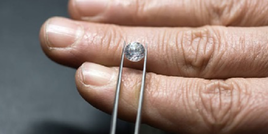 Close-up View Of Specialist Measures The Weight Of Gems.